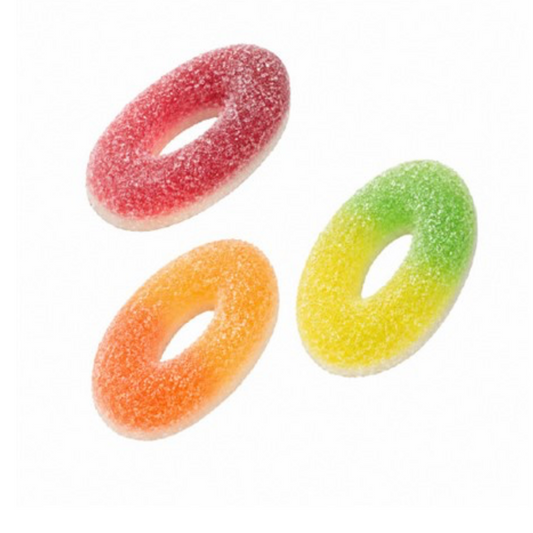 Three sugar-coated donut-shaped gummy candies in red, orange, and yellow-green, arranged on a plain white background.